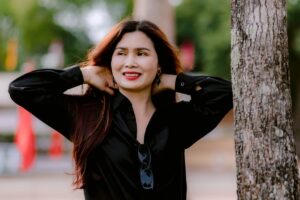 Confident woman smiling outdoors representing Cialis user confidence